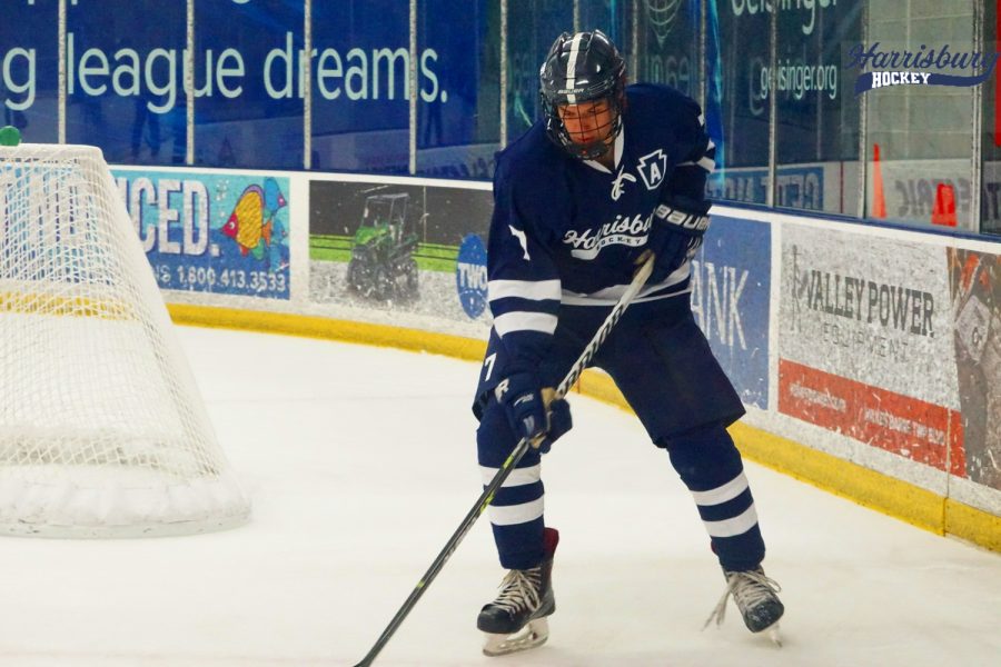 Defenseman Will Tissue breaks the puck out of the zone for the Nittany Lions.
