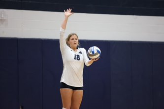 Alyssa Snyder serves the ball.