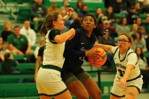 Guard Ciani Redd-Howard makes a play during the United East Championship game against Morrisville St.
Photo by Sports Information